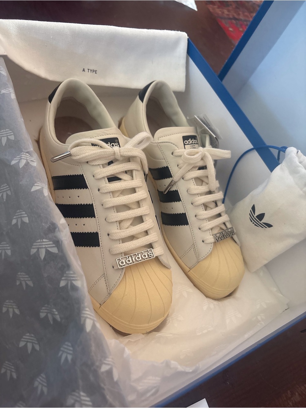adidas Men’s Sneakers in Cream with Black Stripes and Yellow Shelltoe